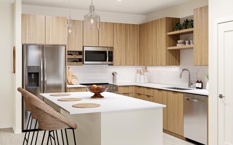 a kitchen with a bar stools at an island